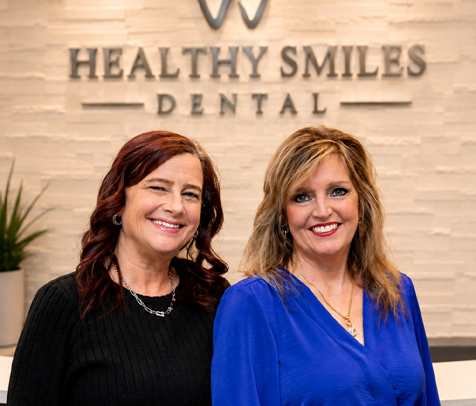 Three smiling team members at Healthy Smiles Dental