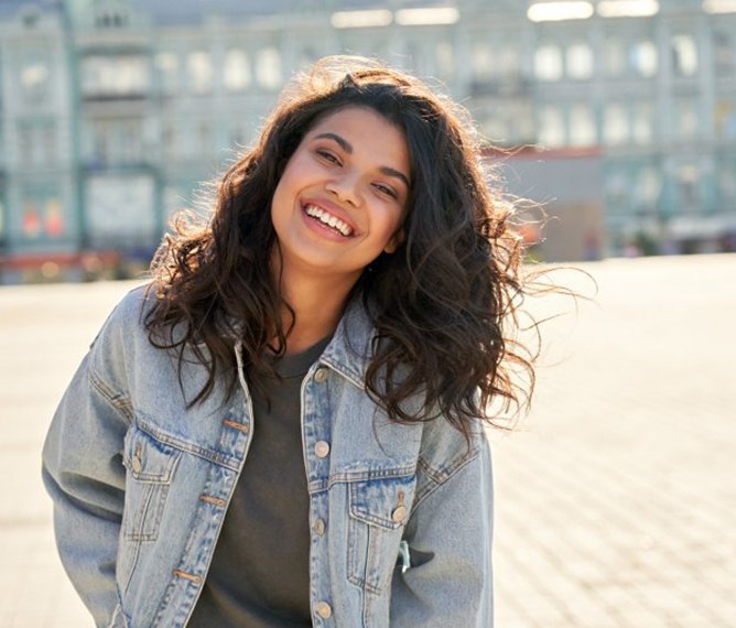 Lady smiles in parking lot